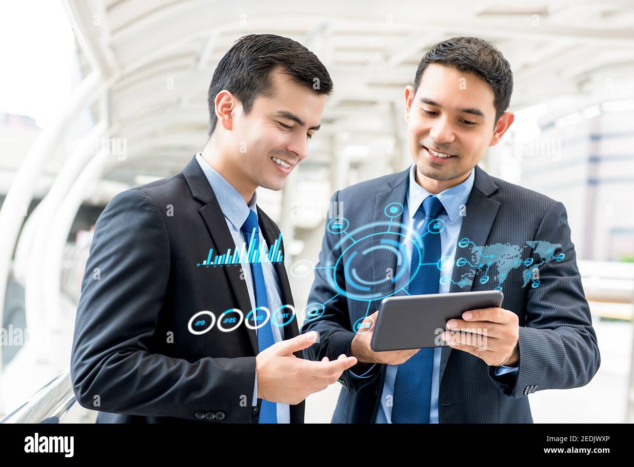 Businessmen discussing investment project using online digital information technology on tablet computer Stock Photo