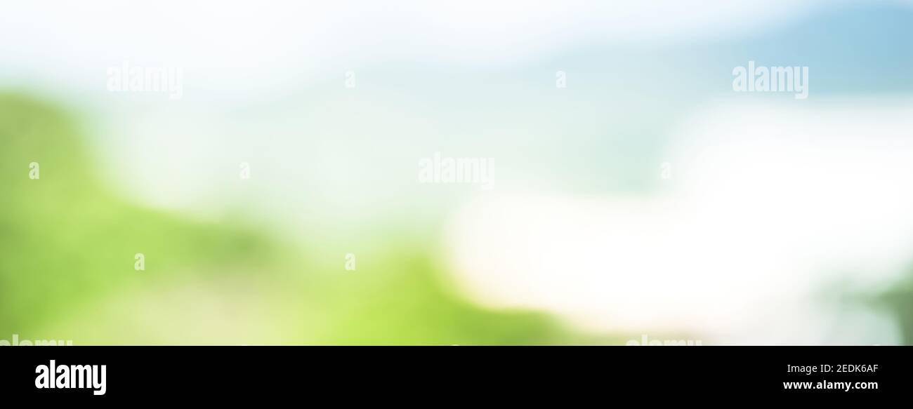 Horizontal panoramic web banner bokeh background with abstract blur white light blue and natural green shade Stock Photo