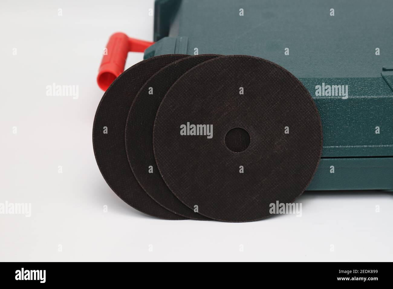 Abrasive black wheel, grinding wheel on the background of the green