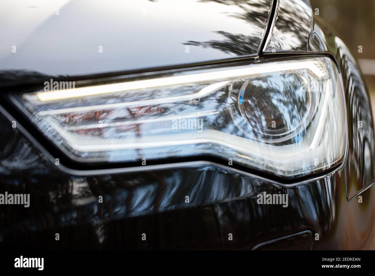 GRODNO, BELARUS - DECEMBER 2019: Audi A6 4G C7 Luxury Black car parts left  front headlight and fog light with Running Headlamps turned on closeup  Stock Photo - Alamy