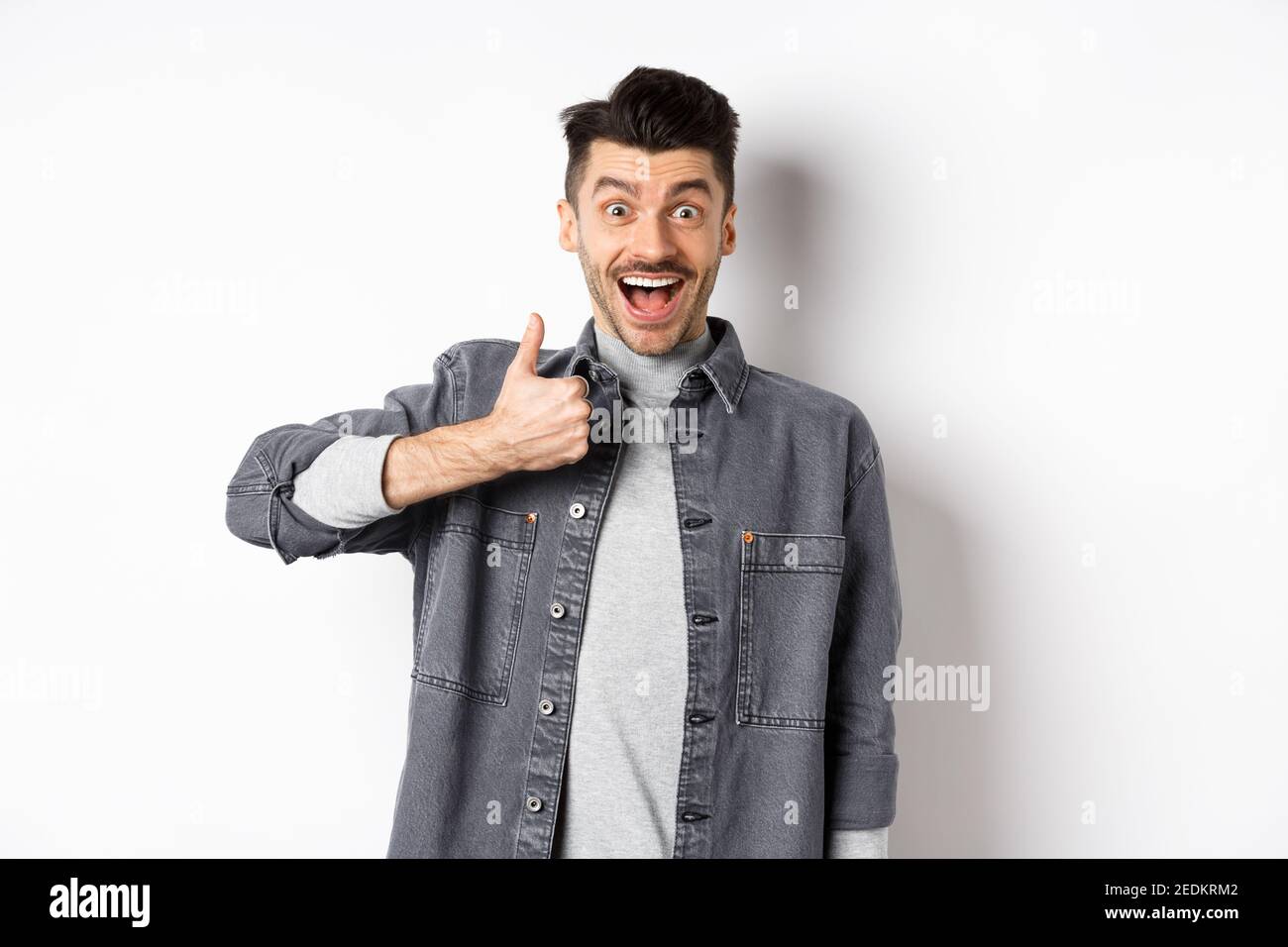 Well done, very good. Excited handsome guy praising nice work, showing ...