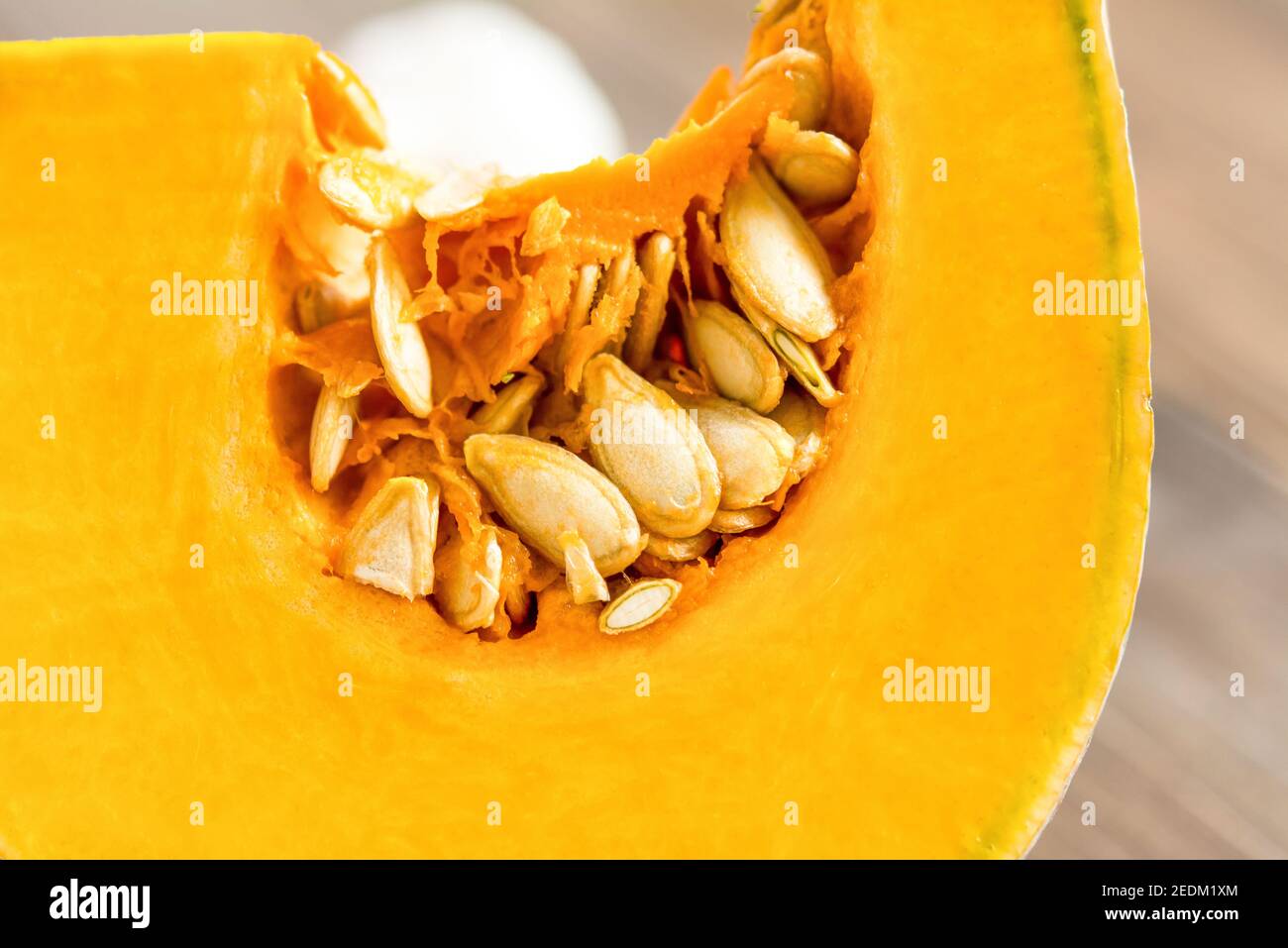 Closed up of fresh raw sliced yellow pumpkin, flesh and seeds Stock Photo