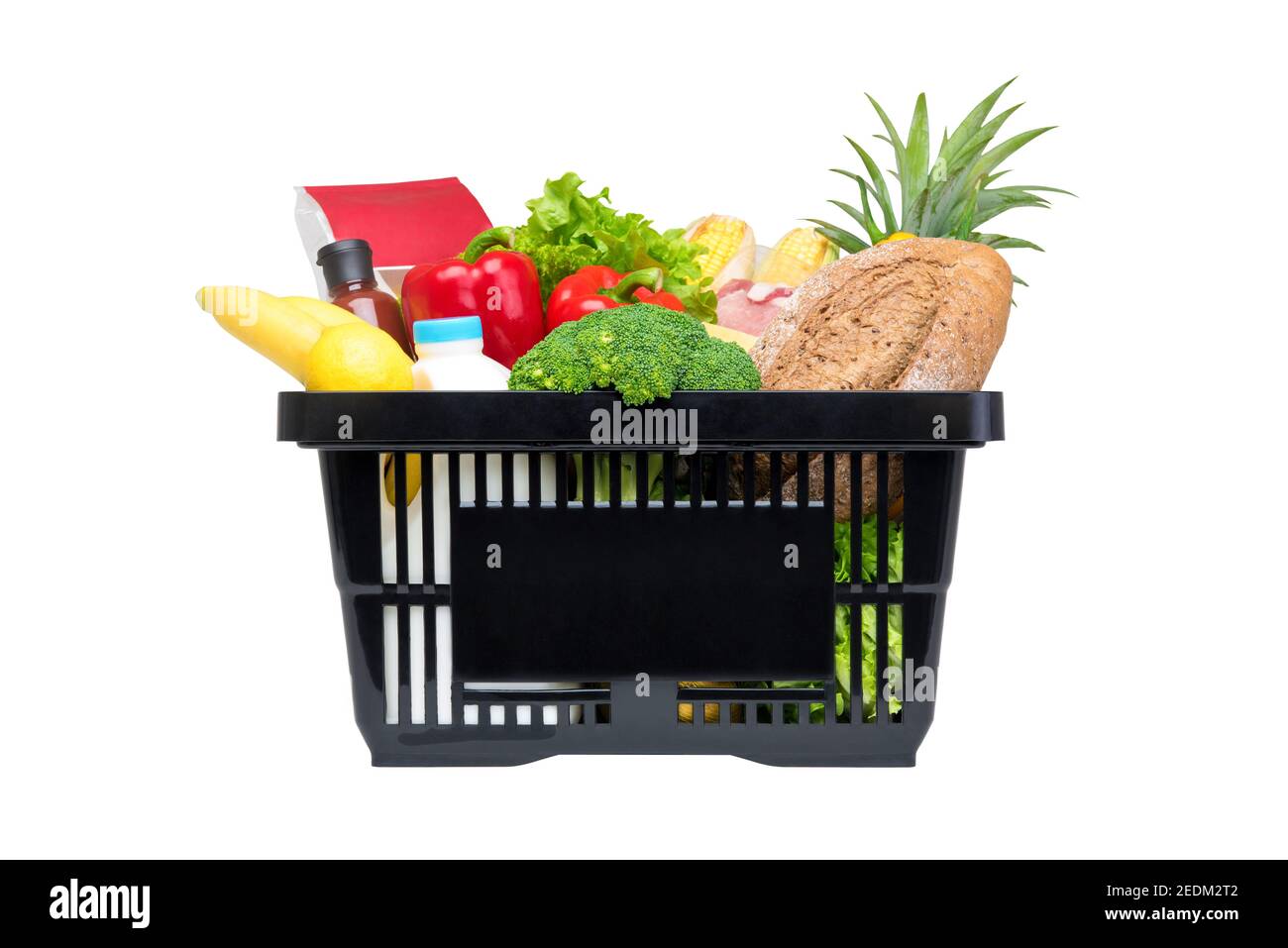 Black shopping basket full of food and groceries, studio shot isolated on white background Stock Photo
