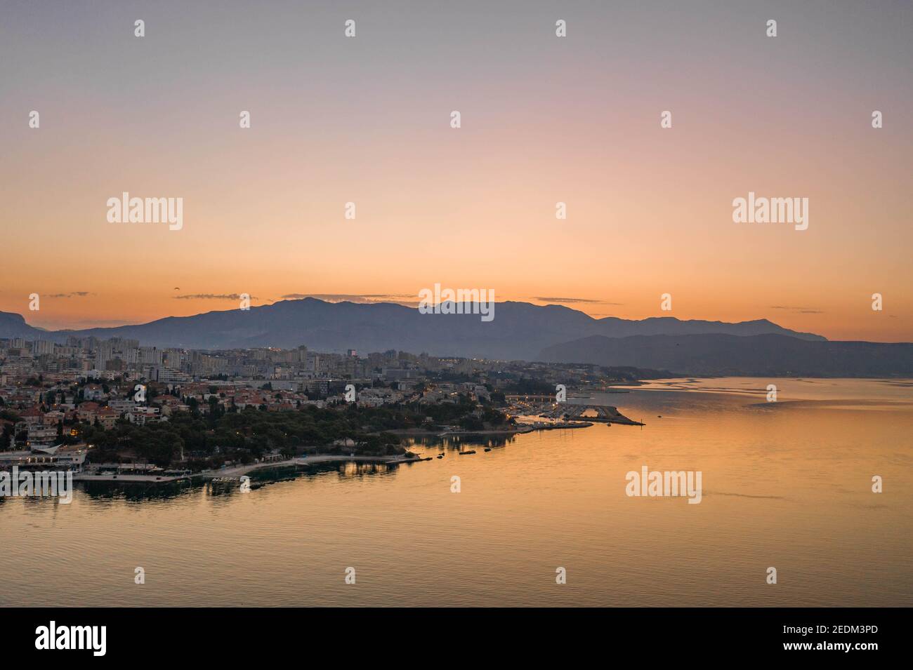 Aerial drone shot of Split city coastline with view of Mount Morso in before sunrise in Croatia Stock Photo