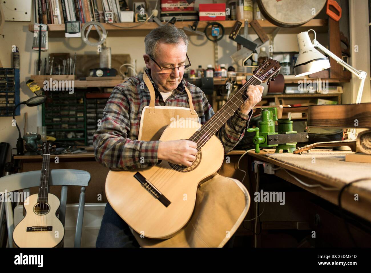 Welsh Guitar maker Paul Beauchamp working on a hand made acoustic