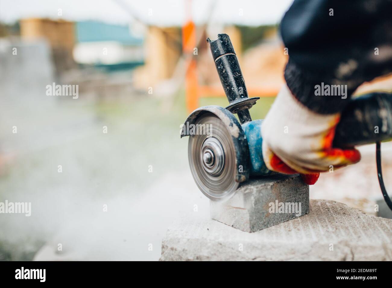 Dust from cutting concrete stone with an electric grinder diamond