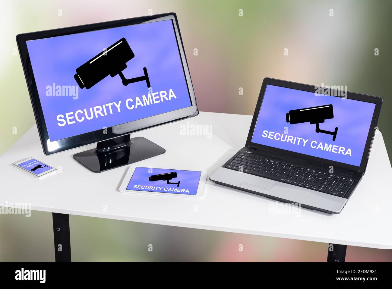 Security camera concept shown on different information technology devices Stock Photo