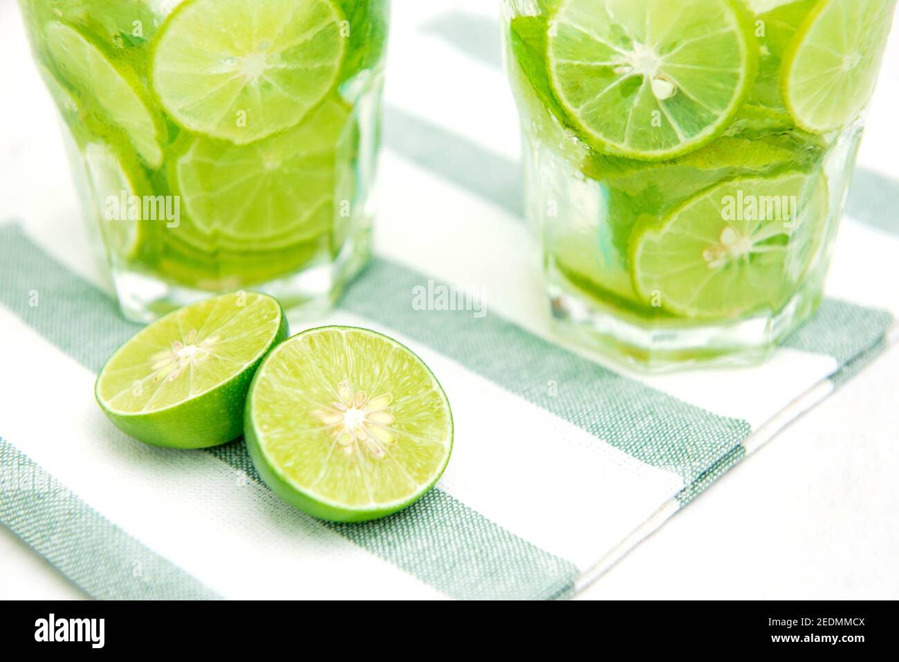 Juicy fresh cut limes, including slices in the glasses, prepared for
