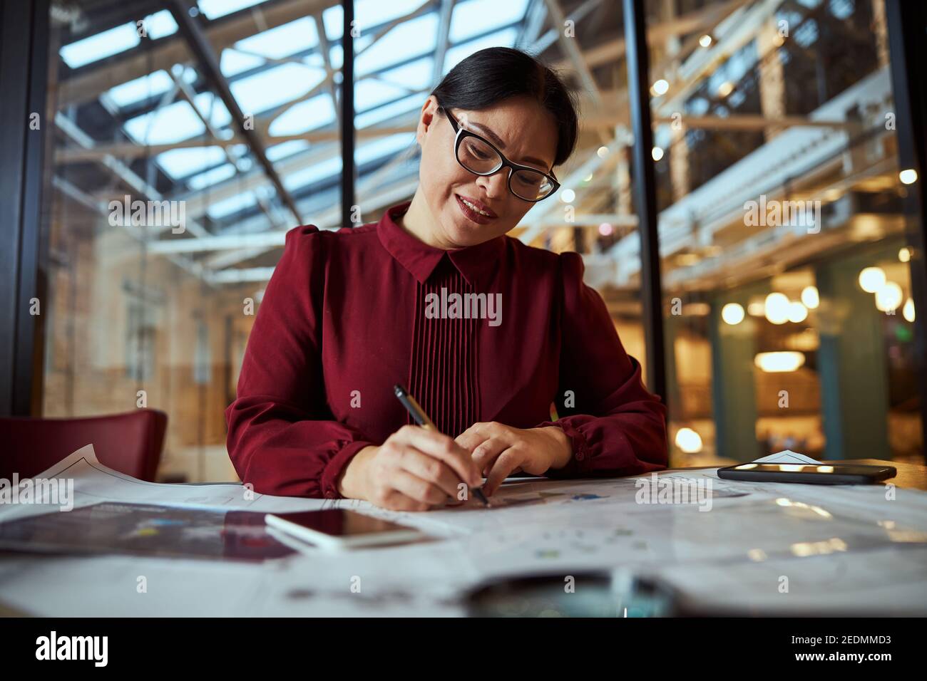 Attentive woman making notes hi-res stock photography and images - Alamy