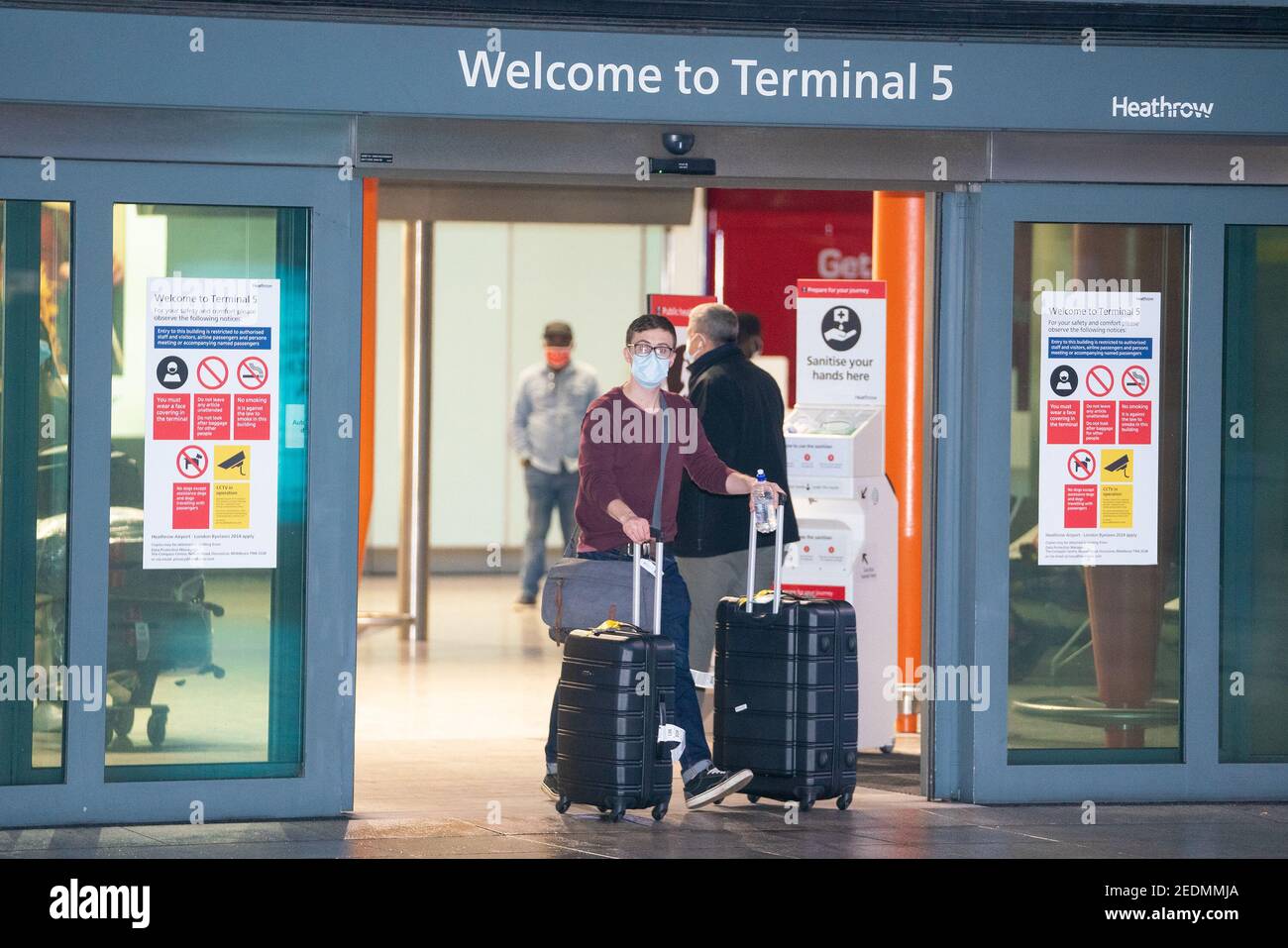 Passengers arrive at London Heathrow's Terminal 5 on the first flight to the airport from one of 33 'red list' countries to which new mandatory coronavirus rules apply. Picture date: Monday February 15, 2021. Stock Photo