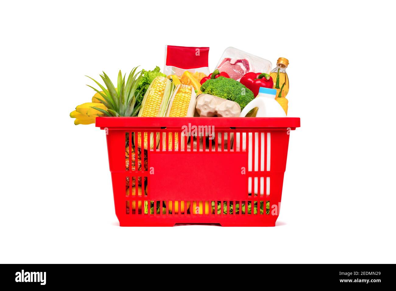 Red shopping basket full of food and groceries, studio shot isolated on white background Stock Photo