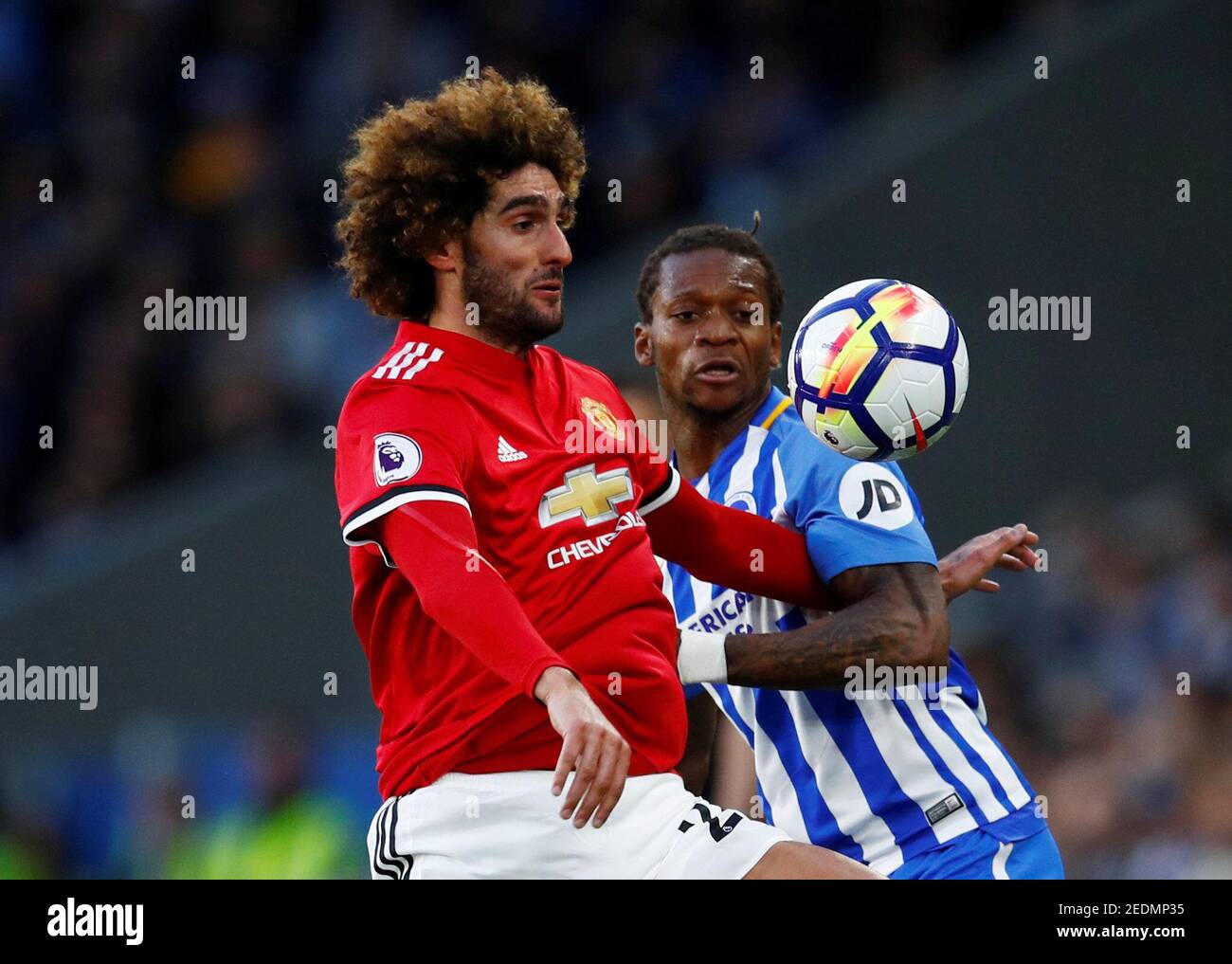 Soccer Football - Premier League - Brighton & Hove Albion v Manchester United - The American Express Community Stadium, Brighton, Britain - May 4, 2018   Manchester United's Marouane Fellaini in action with Brighton's Gaetan Bong   REUTERS/Eddie Keogh    EDITORIAL USE ONLY. No use with unauthorized audio, video, data, fixture lists, club/league logos or "live" services. Online in-match use limited to 75 images, no video emulation. No use in betting, games or single club/league/player publications.  Please contact your account representative for further details. Stock Photo