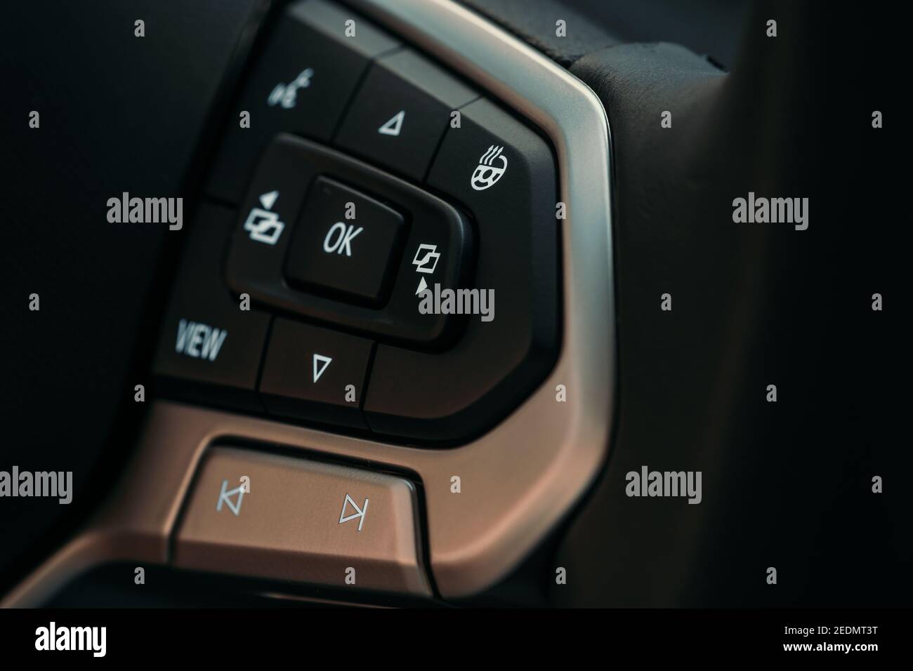 Multifunctions control buttons on modern steering wheel in new car