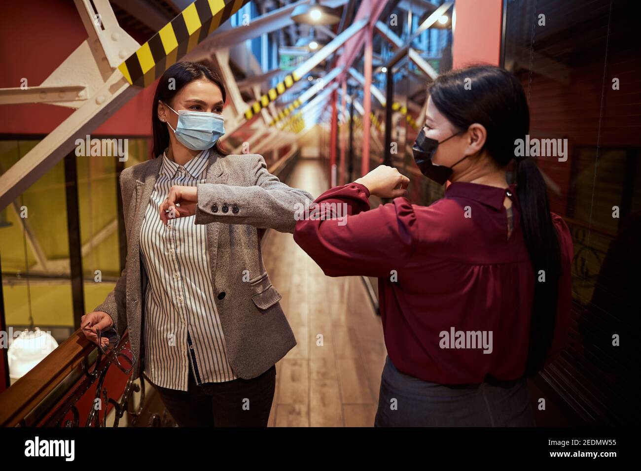 Touching elbows hires stock photography and images Alamy