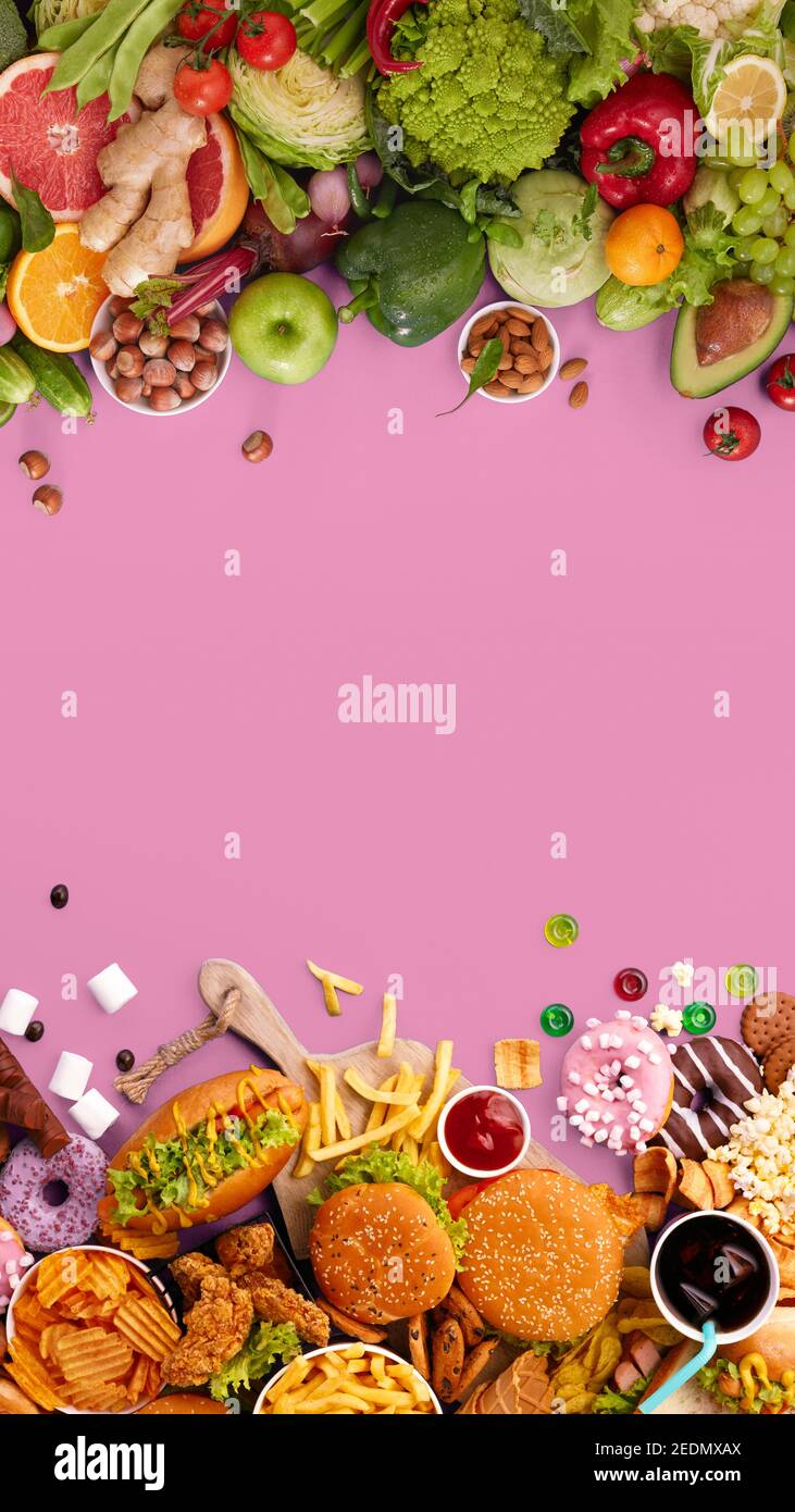 Fast and healthy food compared on pink background. Unhealthy set of burgers, sauces, french fries in comparison with set of vegetables, fruits, organic green avocado, cabbage, nuts, citruses. Stock Photo