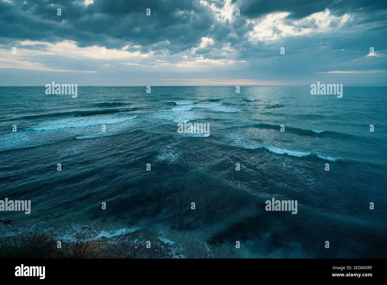 Sea or Ocean Dramatic Seascape Panorama in dark blue moody colors. Stock Photo