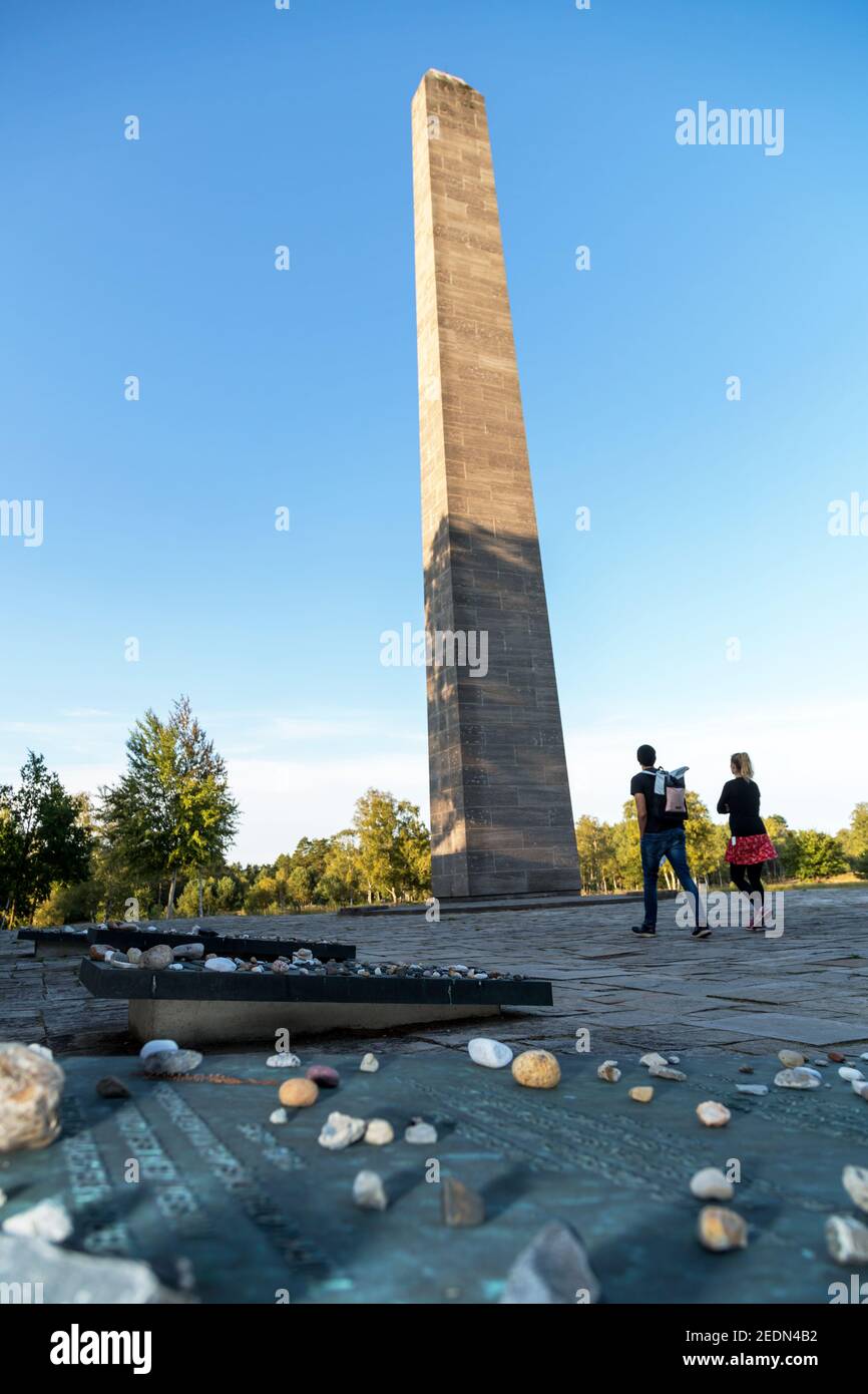 19.09.2020, Lohheide, Lower Saxony, Germany - Bergen-Belsen memorial, obelisk, small commemorative stones in front, placed by Jewish visitors. In the Stock Photo