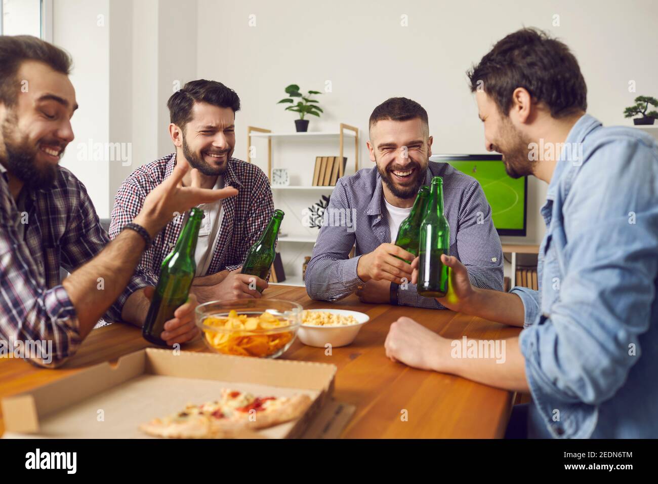 Home gathering with beer and food for male company Stock Photo Alamy