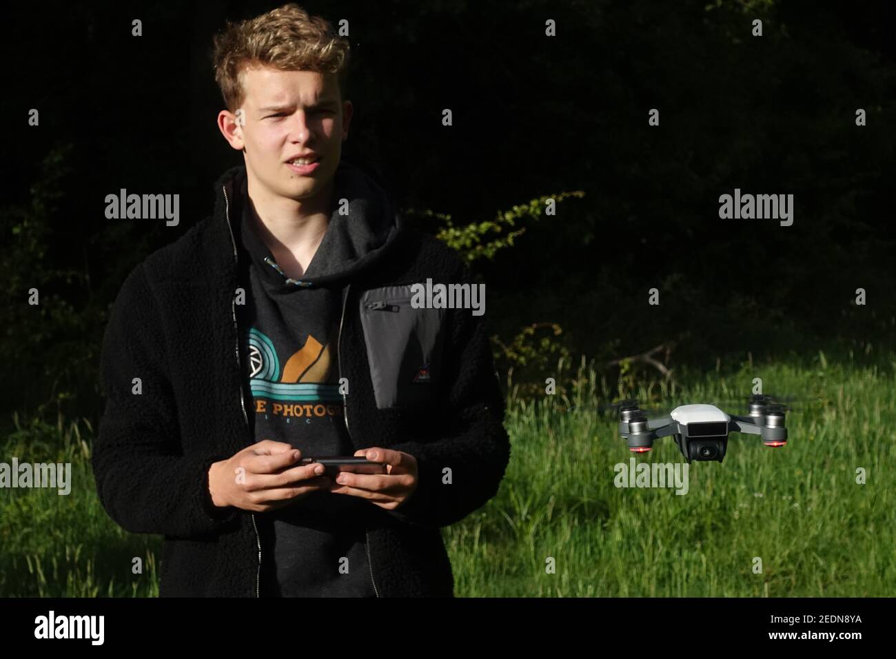 24.05.2020, Dranse, Brandenburg, Germany - Teenager flying a camera drone.. 00S200524D075CAROEX.JPG [MODEL RELEASE: NO, PROPERTY RELEASE: NO (c) caro Stock Photo