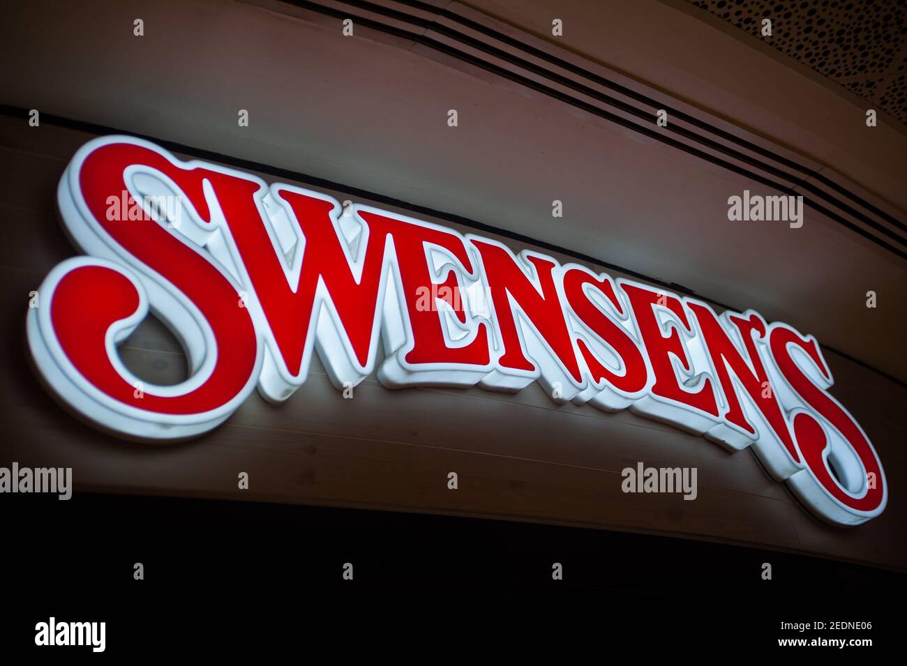 12.03.2020, Singapore, , Singapore - Illuminated company sign with the ...
