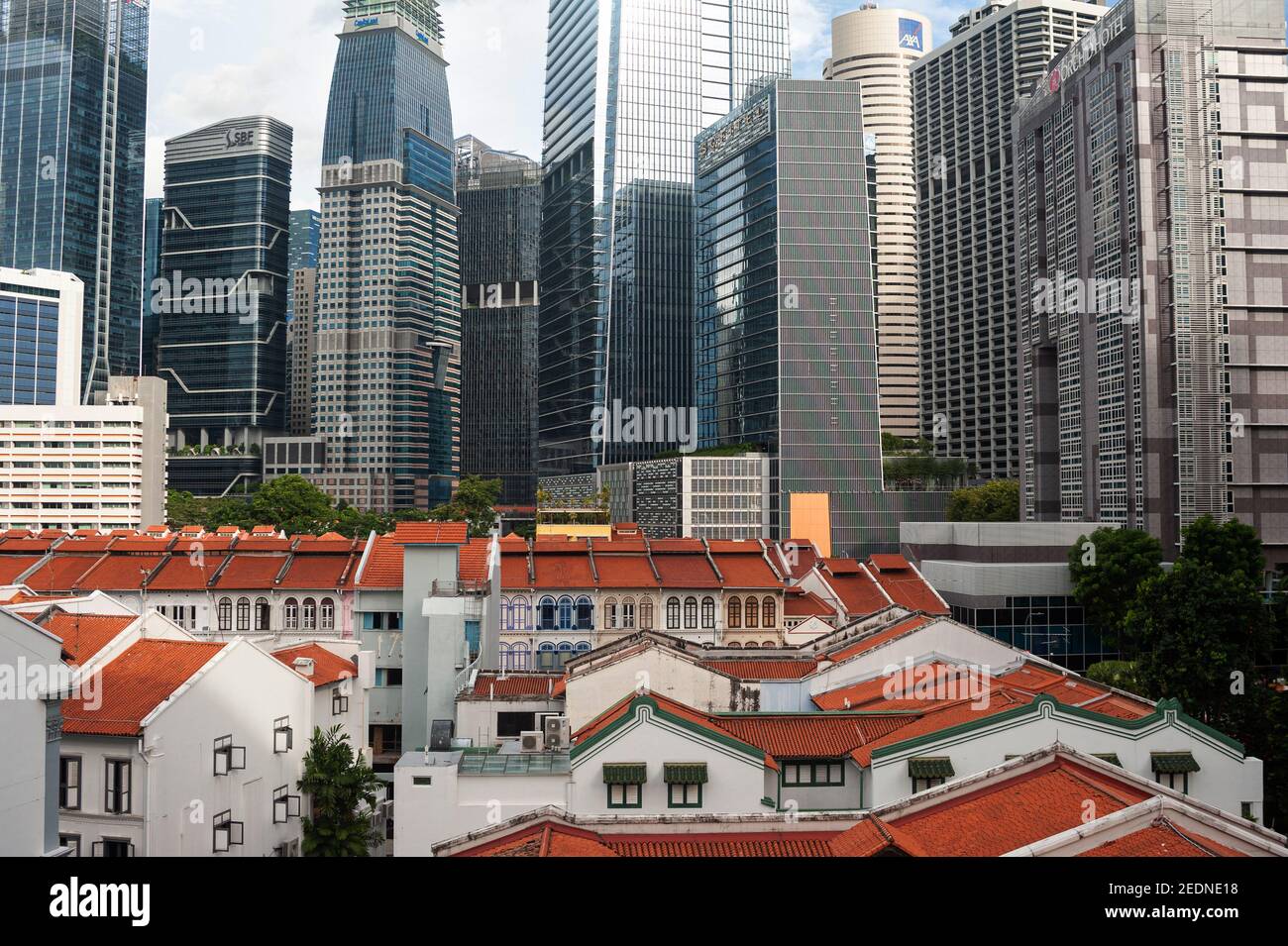 02.12.2020, Singapore, , Singapore - Looking over the roofs of traditional shophouses in the historic Tanjong Pagar district to the modern skyscrapers Stock Photo