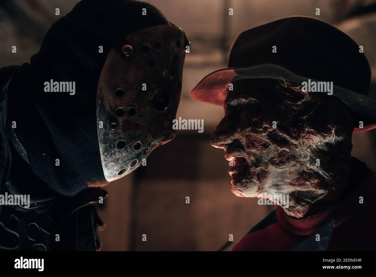 Portrait of cosplayers in image of Freddy Krueger and Jason Voorhees from Nightmare on Elm Street film. Stock Photo