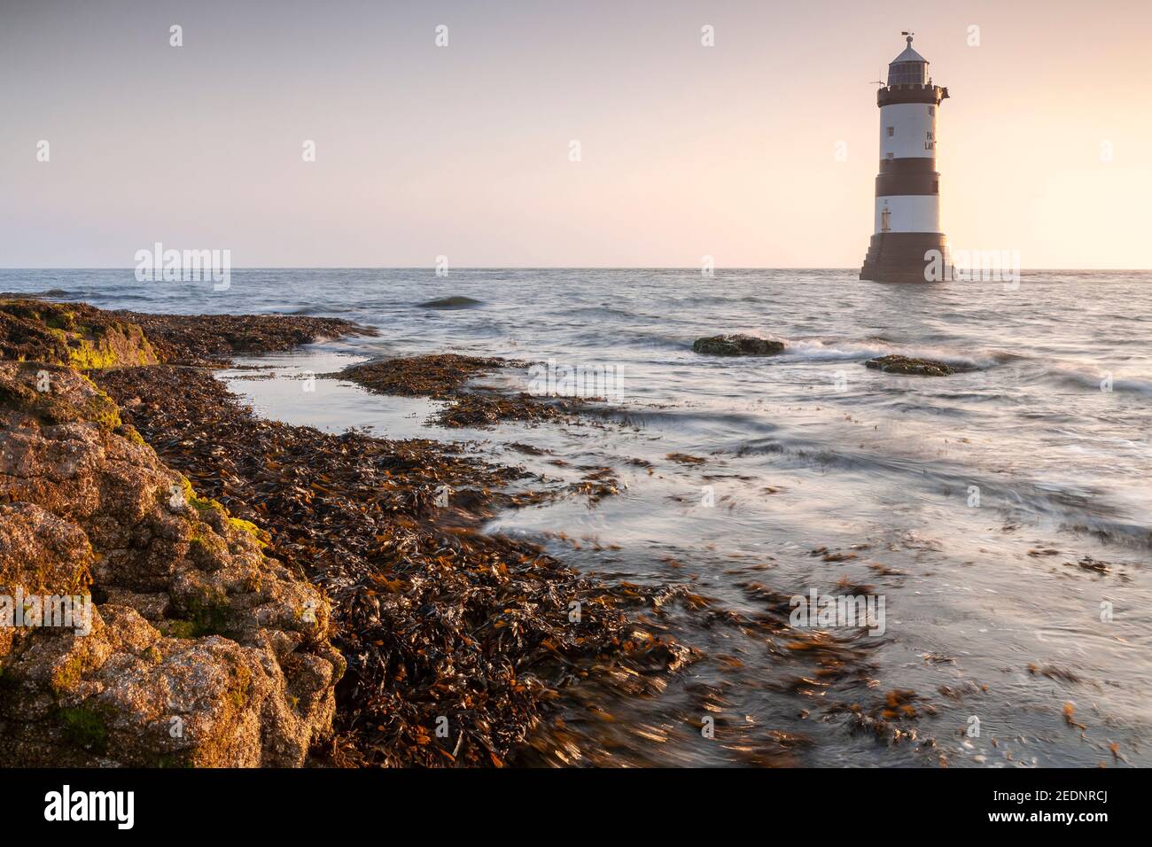 Penmon Point lighthouse at sunrise, Anglesey, North Wales Stock Photo