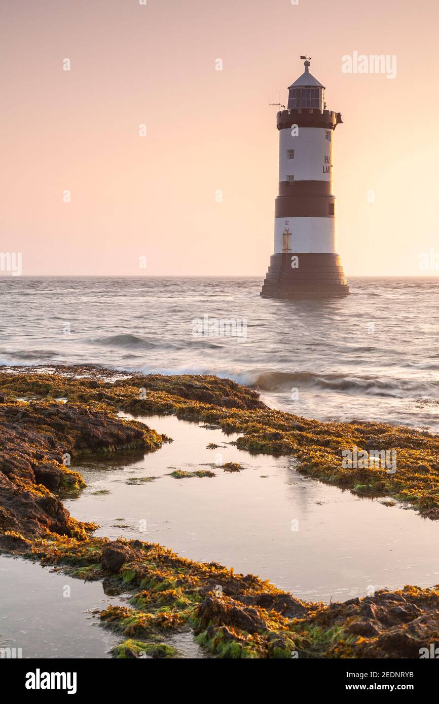Penmon Point lighthouse at sunrise, Anglesey, North Wales Stock Photo