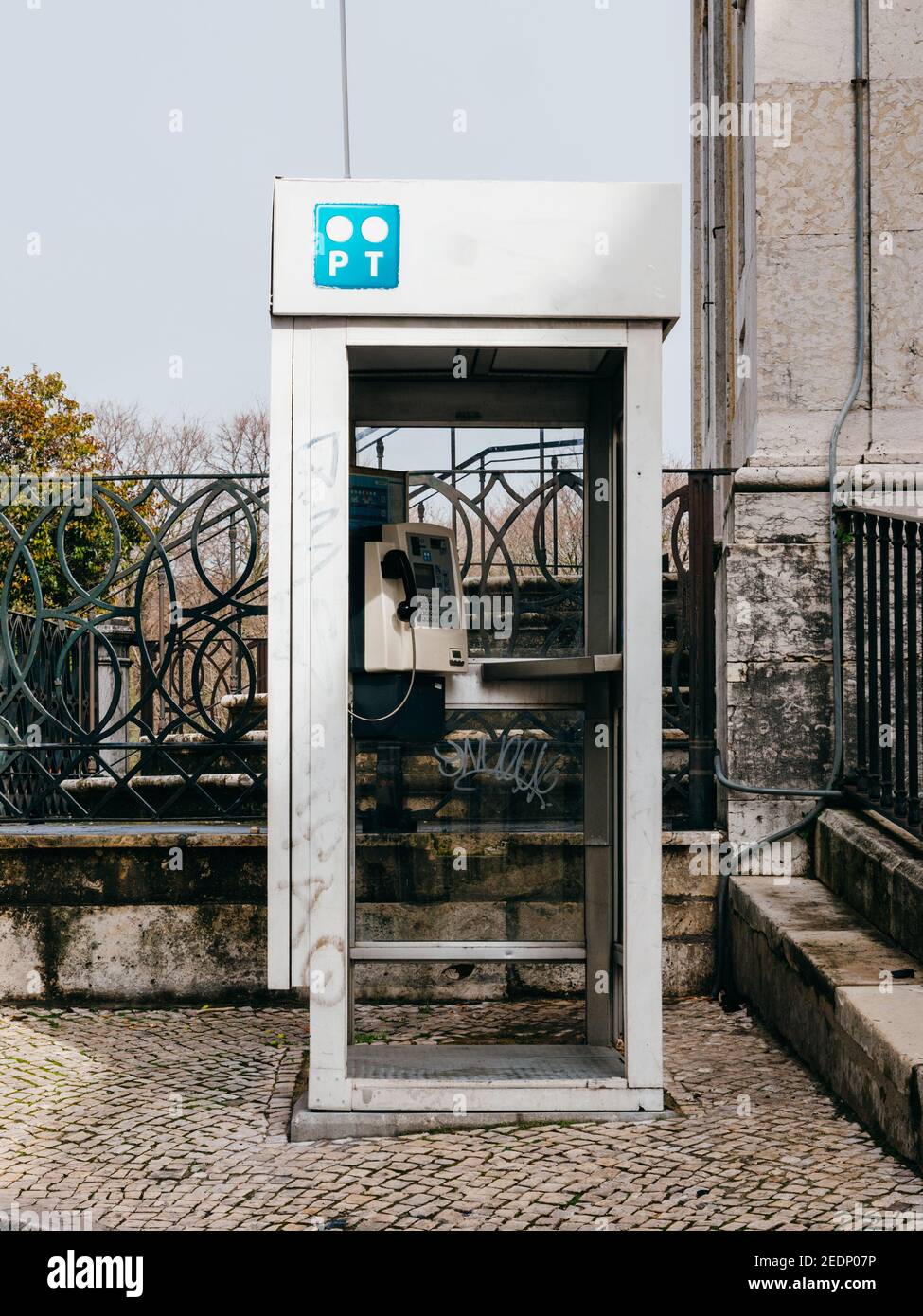 Lisbon, Portugal - Feb 9, 2018: Vintage old PT portugal TElecom phone booth with modern paycard phone inside Stock Photo