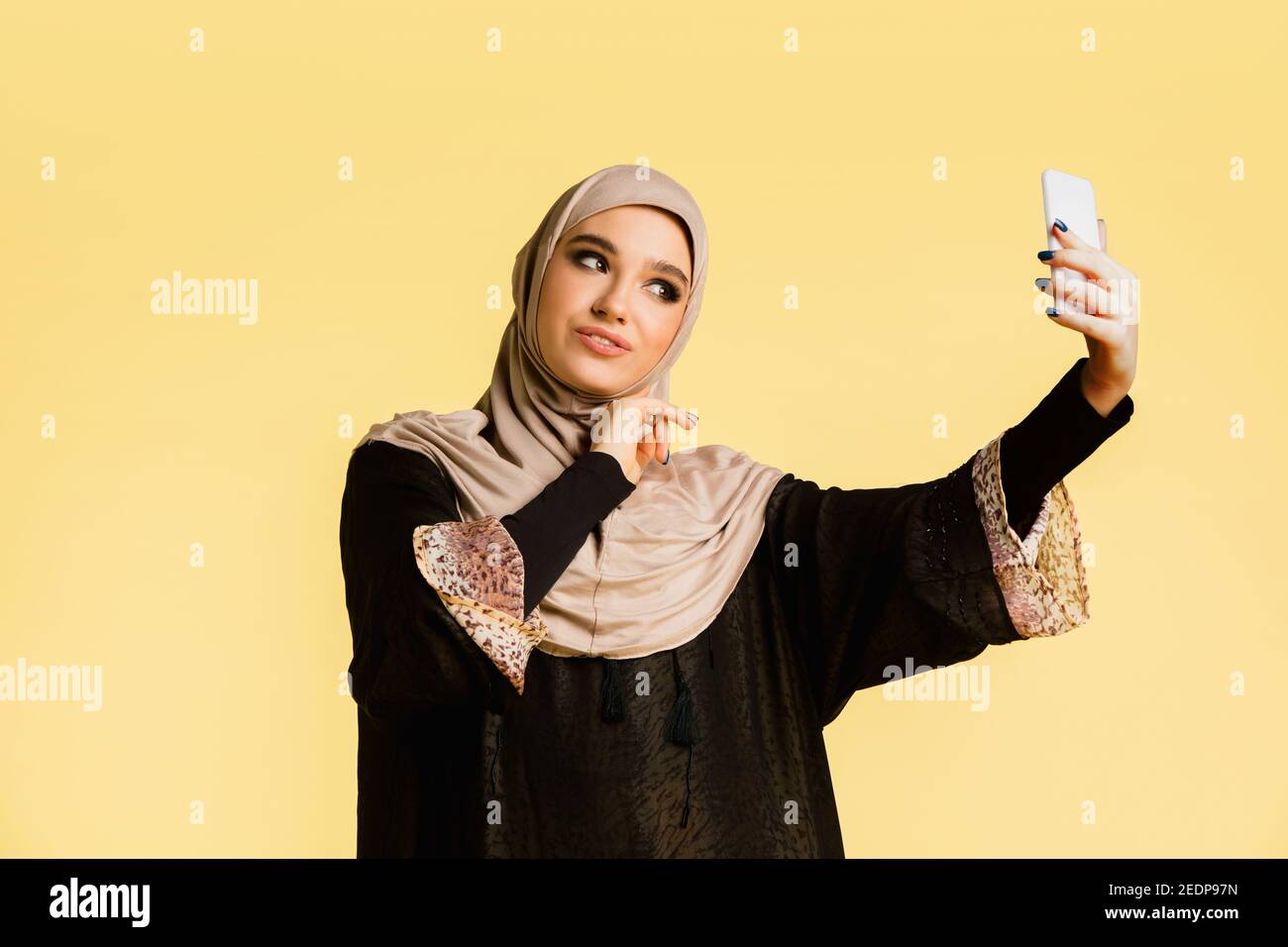 Premium Vector  Young muslim woman wearing hijab taking selfie