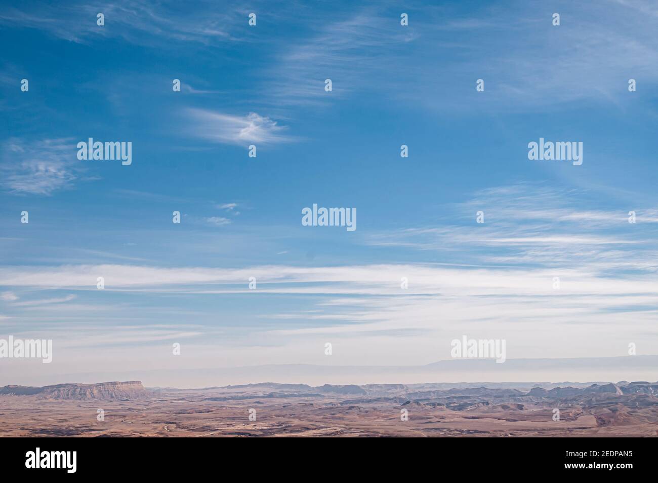 Blue desert sky background with light high, white, feather clouds Photographed in the Negev Desert, Israel in February Stock Photo