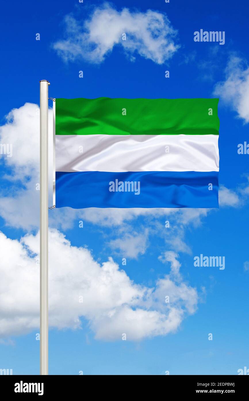 flag of Sierra Leone against blue cloudy sky, Sierra Leone Stock Photo ...