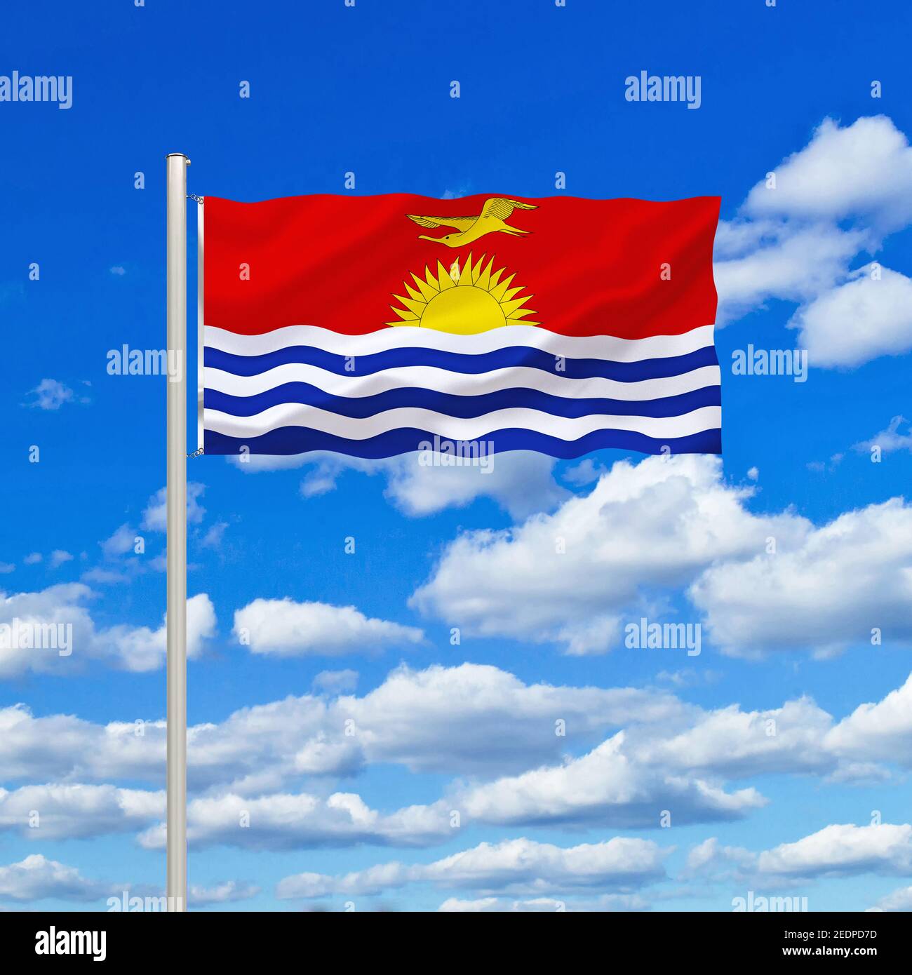 flag of Kiribati against blue cloudy sky, Kiribati Stock Photo