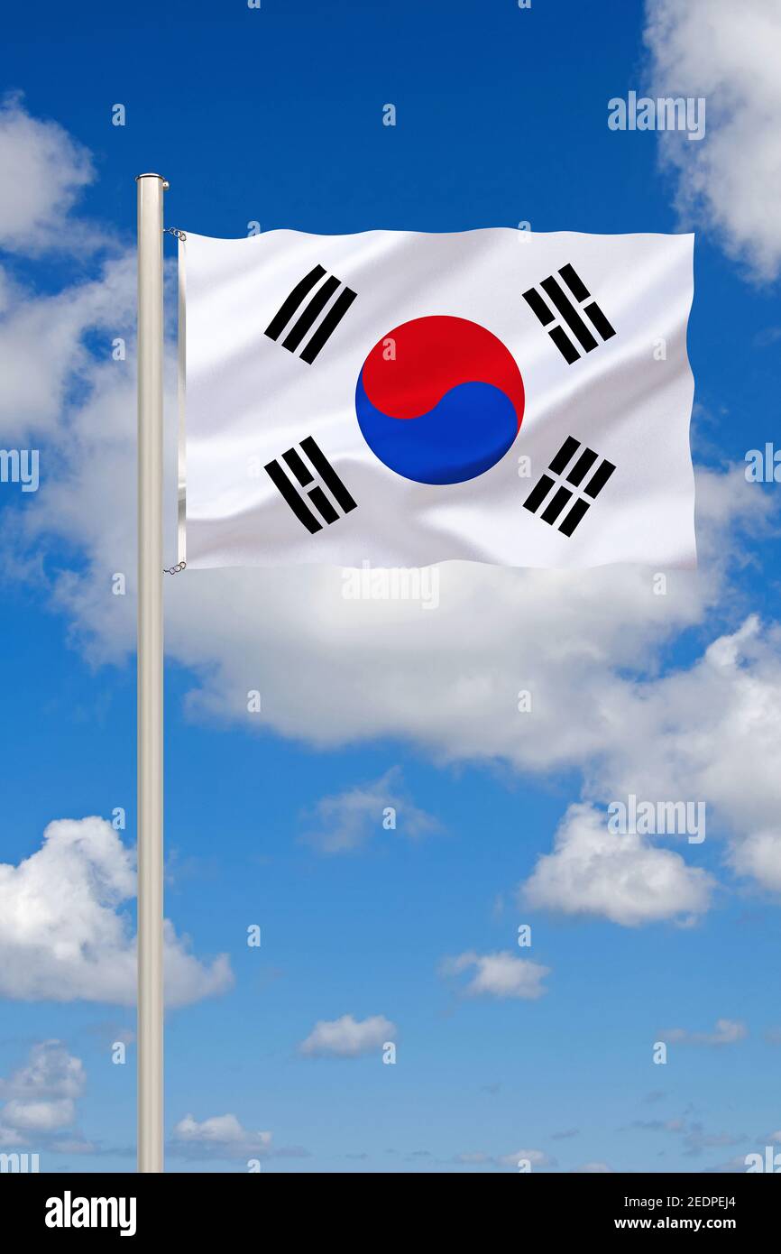 flag of South Korea against blue cloudy sky, South Korea Stock Photo