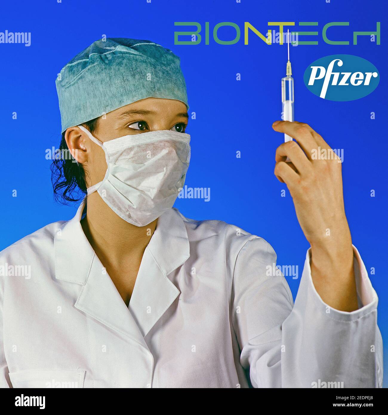 female doc with injection with vaccine of Biontech Pfizer Stock Photo