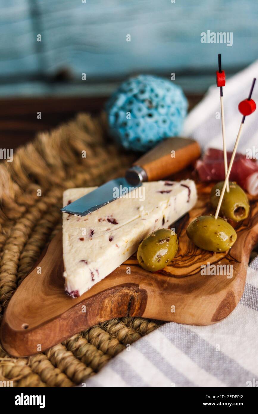 Closeup shot of Wensleydale cheese with cranberries and wine Stock Photo