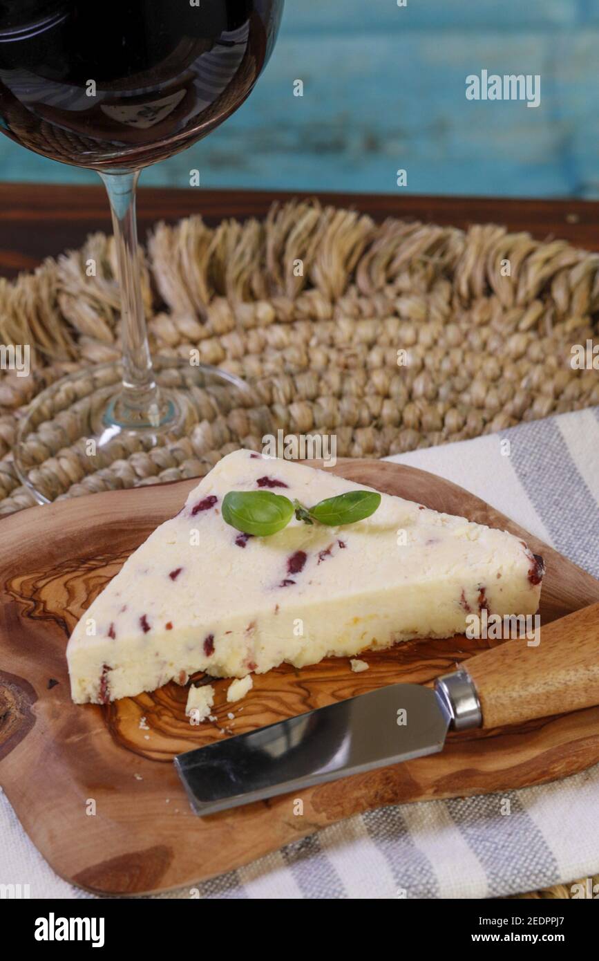 Closeup shot of Wensleydale cheese with cranberries and wine Stock Photo