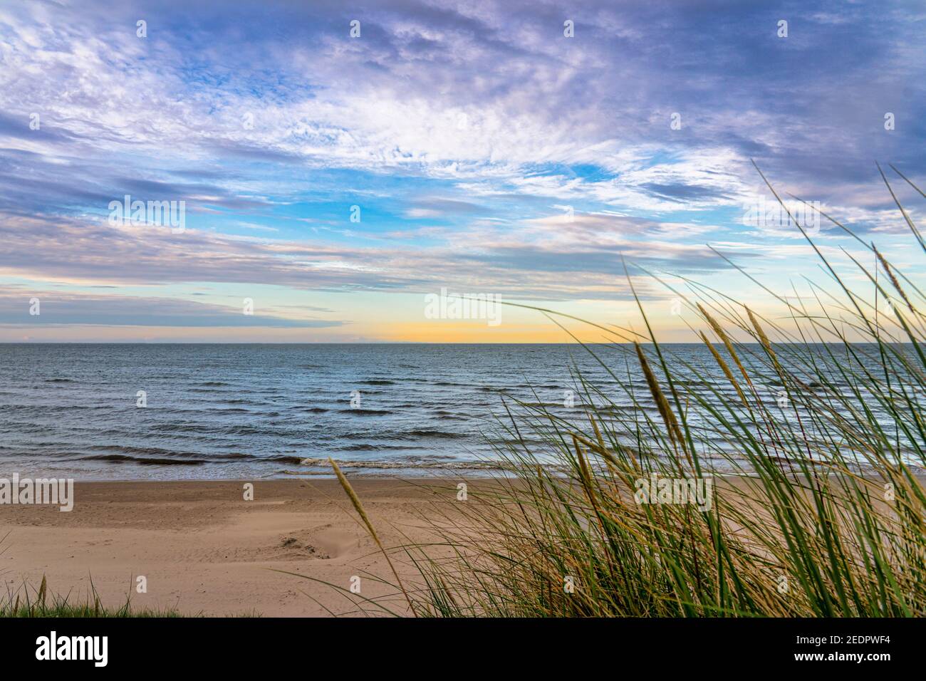 Sunset over the Baltic Sea with seagrass and beach Stock Photo - Alamy