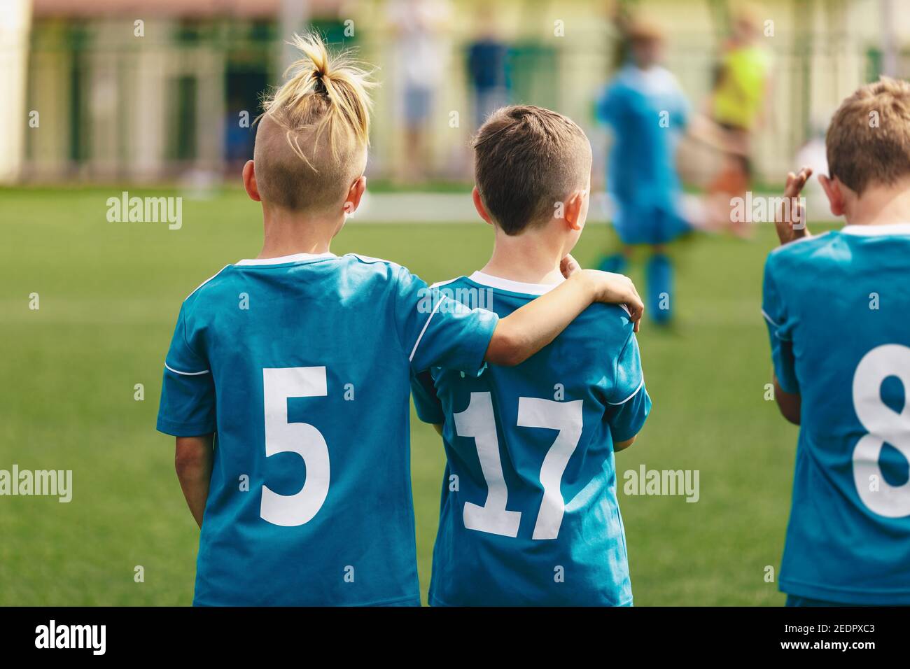 Soccer Boys Teammates. Friendship in a School Sports Team. Happy Kids Standing Together and Watching Football Match Stock Photo
