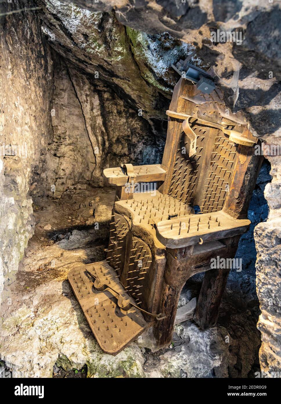 Podzamcze, Poland - August 25, 2020: Torture with chair in medieval Ogrodzieniec Castle, part of Eagles’ Nests Trail at Cracow-Czestochowa upland in S Stock Photo