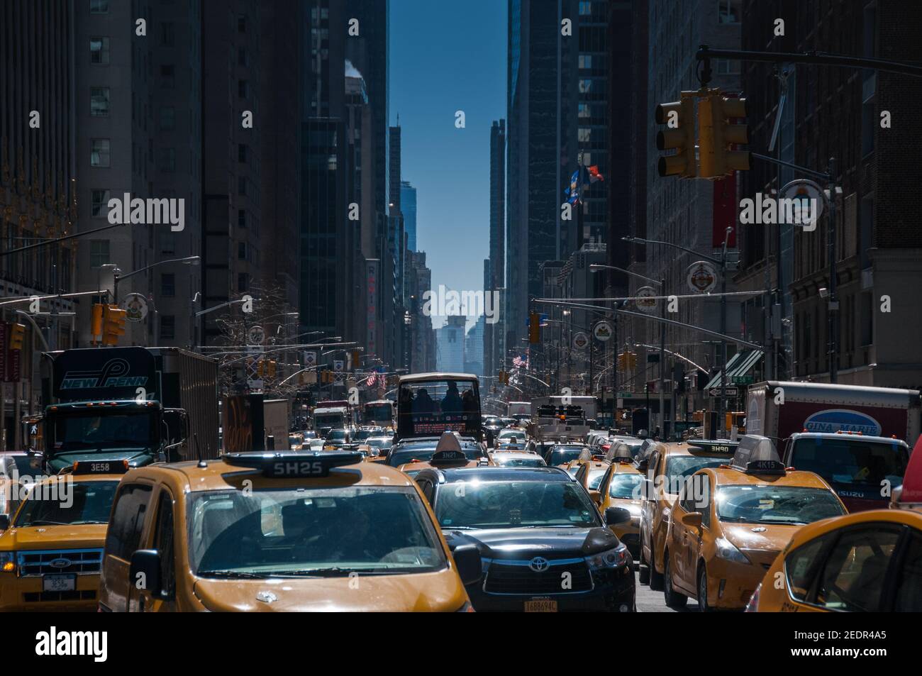 Congested Street of New York crowded people and cars yellow taxis Stock Photo