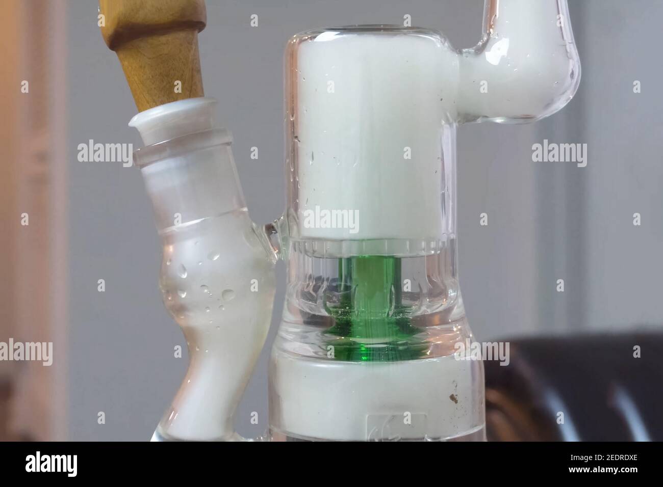 Smoking marijuana through bong. Cannabis smoking hookah system Stock