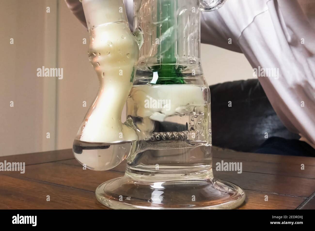 Smoking marijuana through bong. Cannabis smoking hookah system Stock