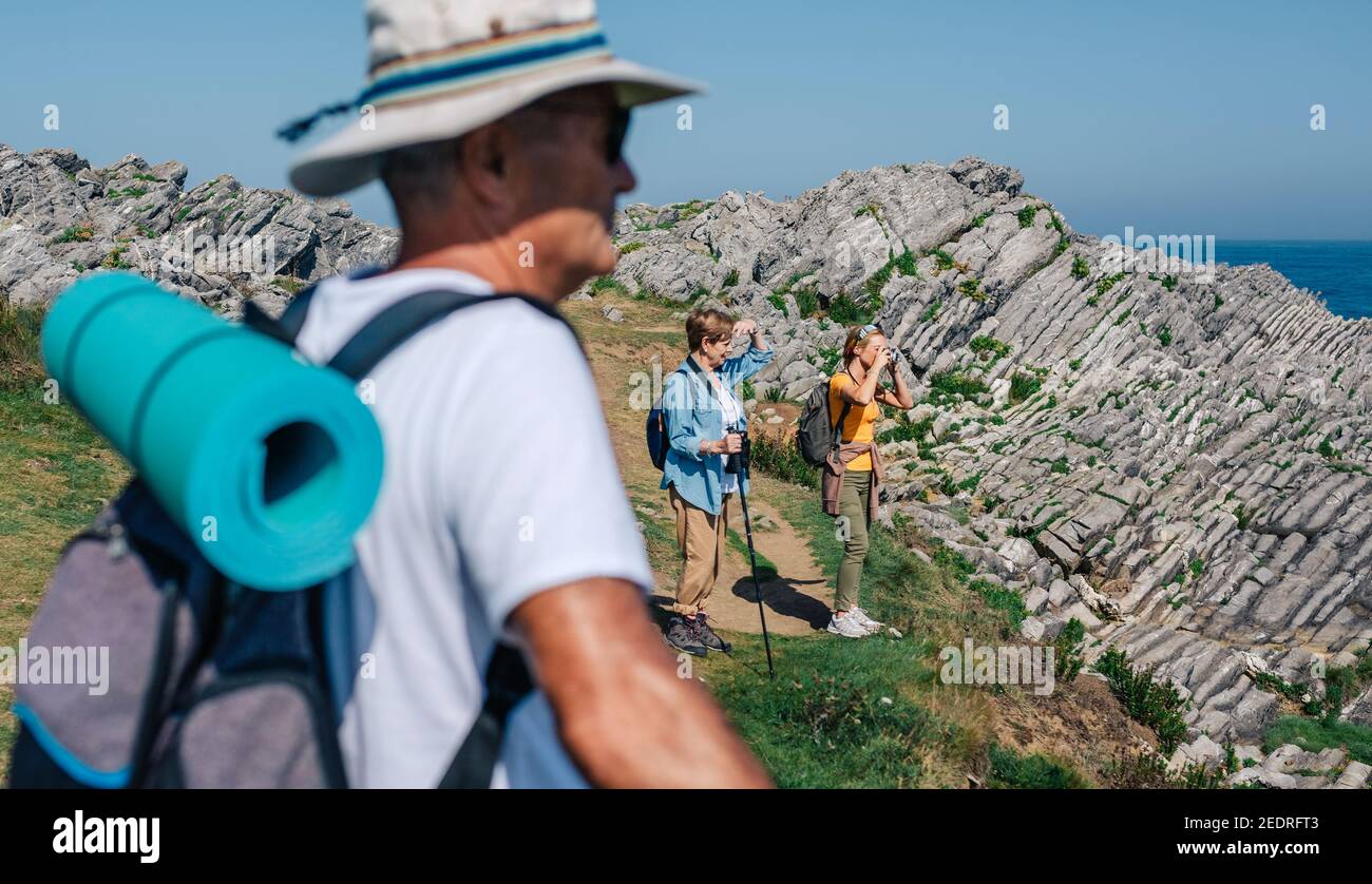 Family practicing trekking together outdoors Stock Photo