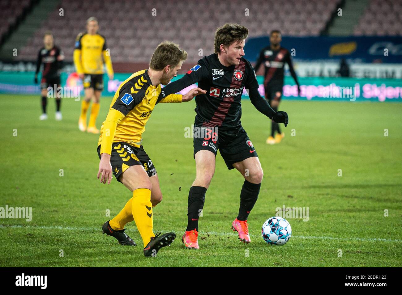 Herning, Denmark. 14th Feb, 2021. Anders Dreyer (36) of FC Midtjylland and Alexander Ludwig (33) of Horsens seen during the 3F Superliga match between FC Midtjylland and AC Horsens at MCH