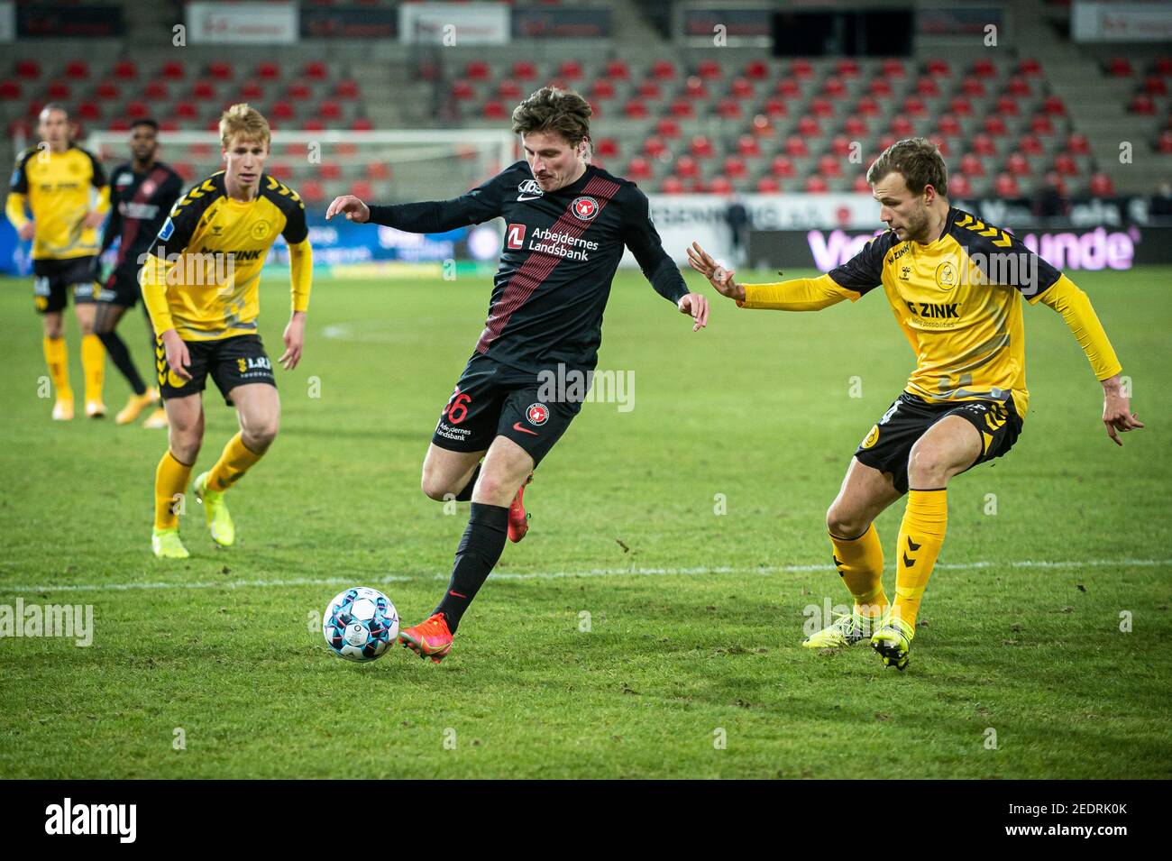 Herning, Denmark. 14th Feb, 2021. Anders Dreyer (36) of FC Midtjylland and  Malte Kiilerich (4) of AC Horsens seen during the 3F Superliga match  between FC Midtjylland and AC Horsens at MCH