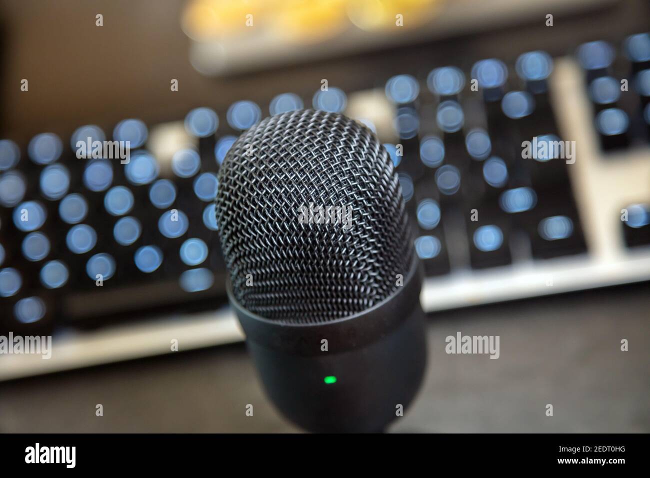 Digital technology concept. Microphone condenser black metallic, blur