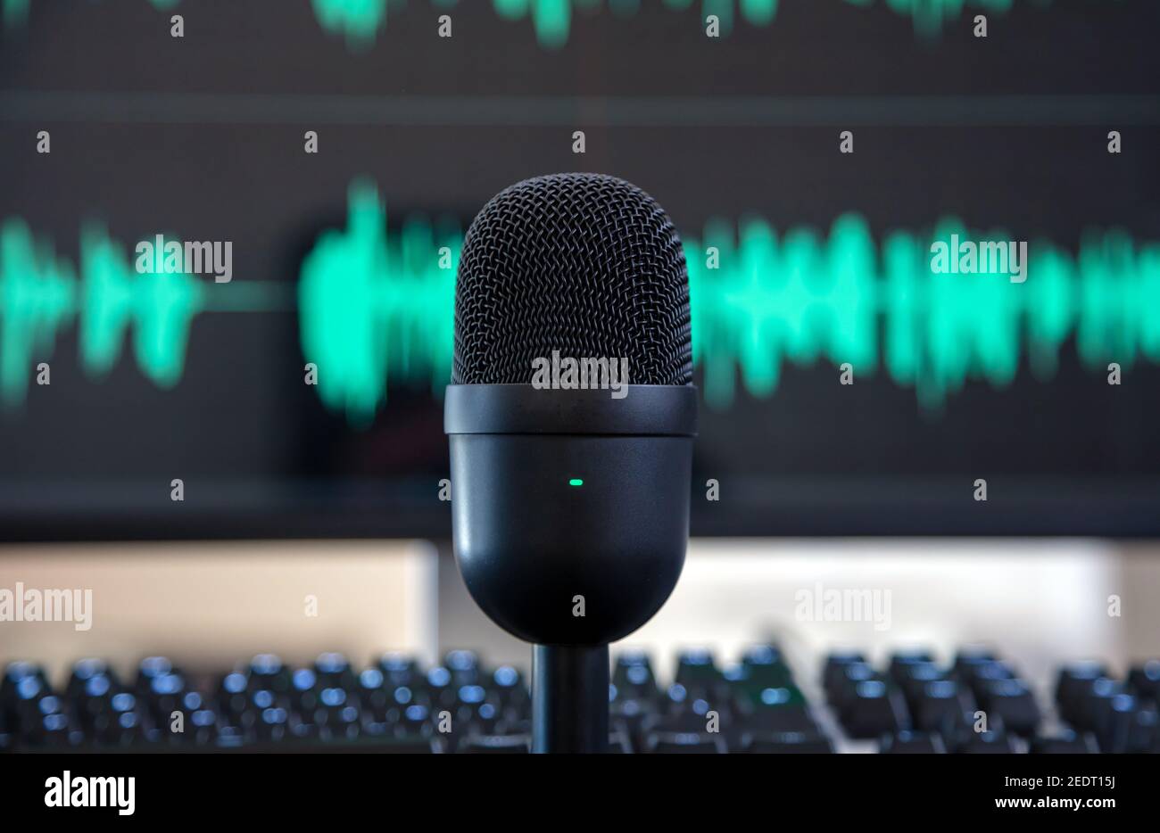 Sound recording concept. Condenser microphone, blur console and turquoise waveform background. Mike for live audio, music, speech, concert, performanc Stock Photo