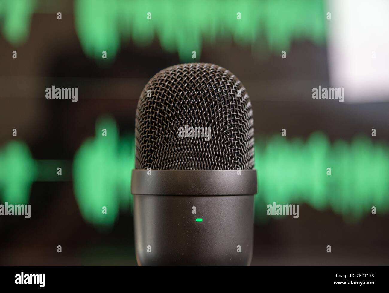 Microphone condenser, blur green waveform background. Sound recording