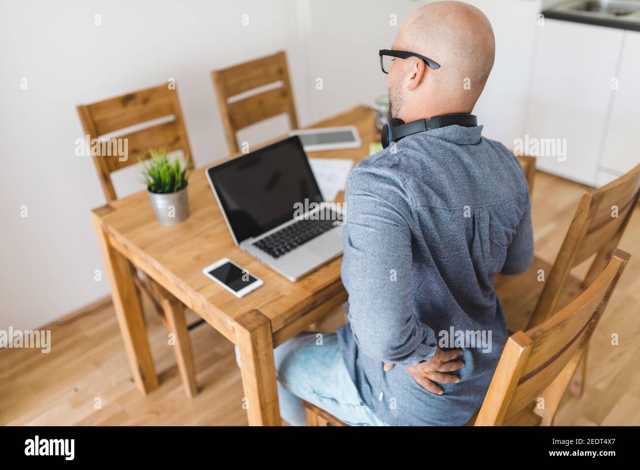 Man working from home during the coronavirus Covid 19 pandemic Stock ...